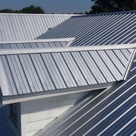 sheet of metal roofing|pitched metal covering roof.